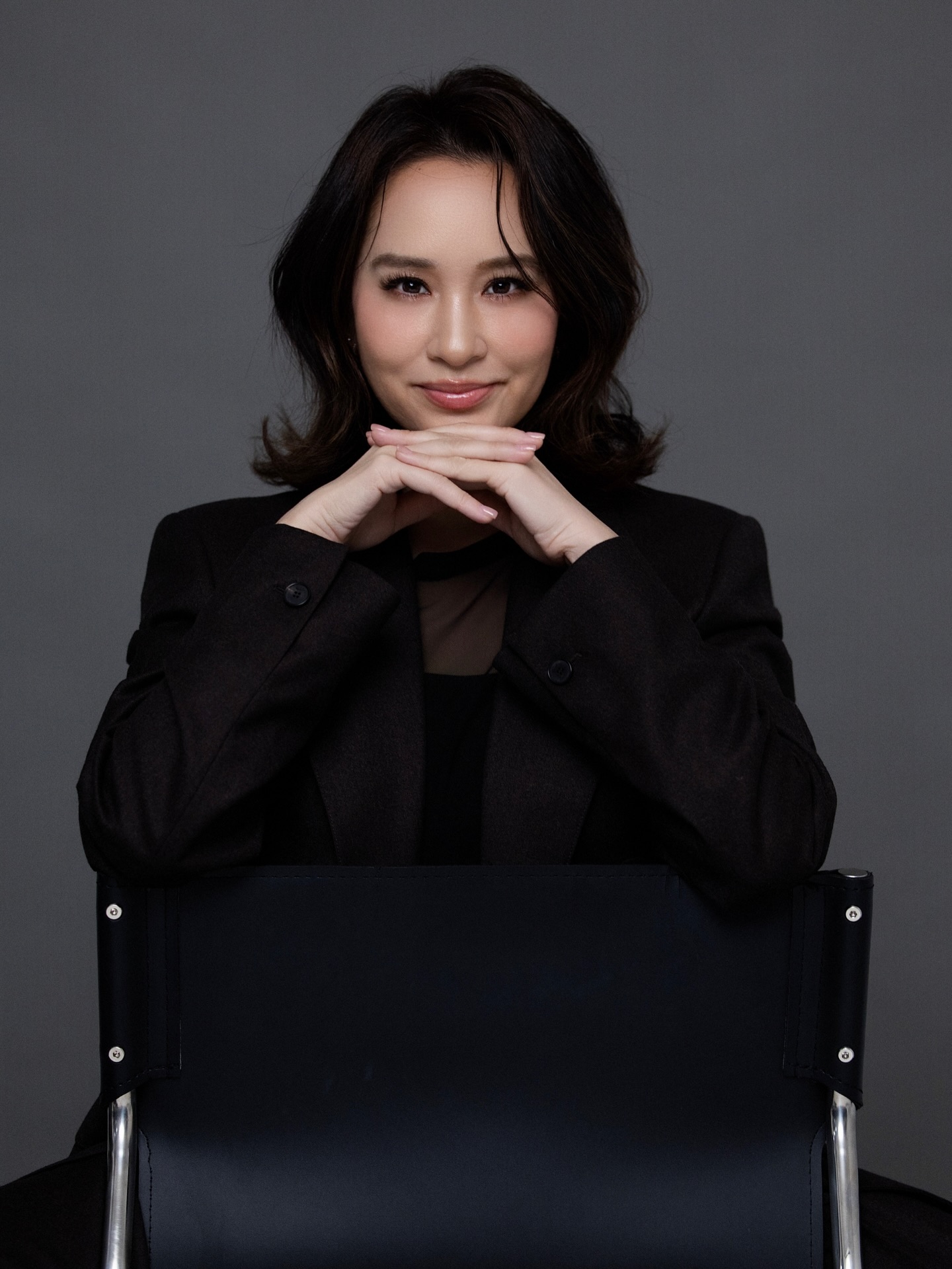Tailored blazer, soft smile