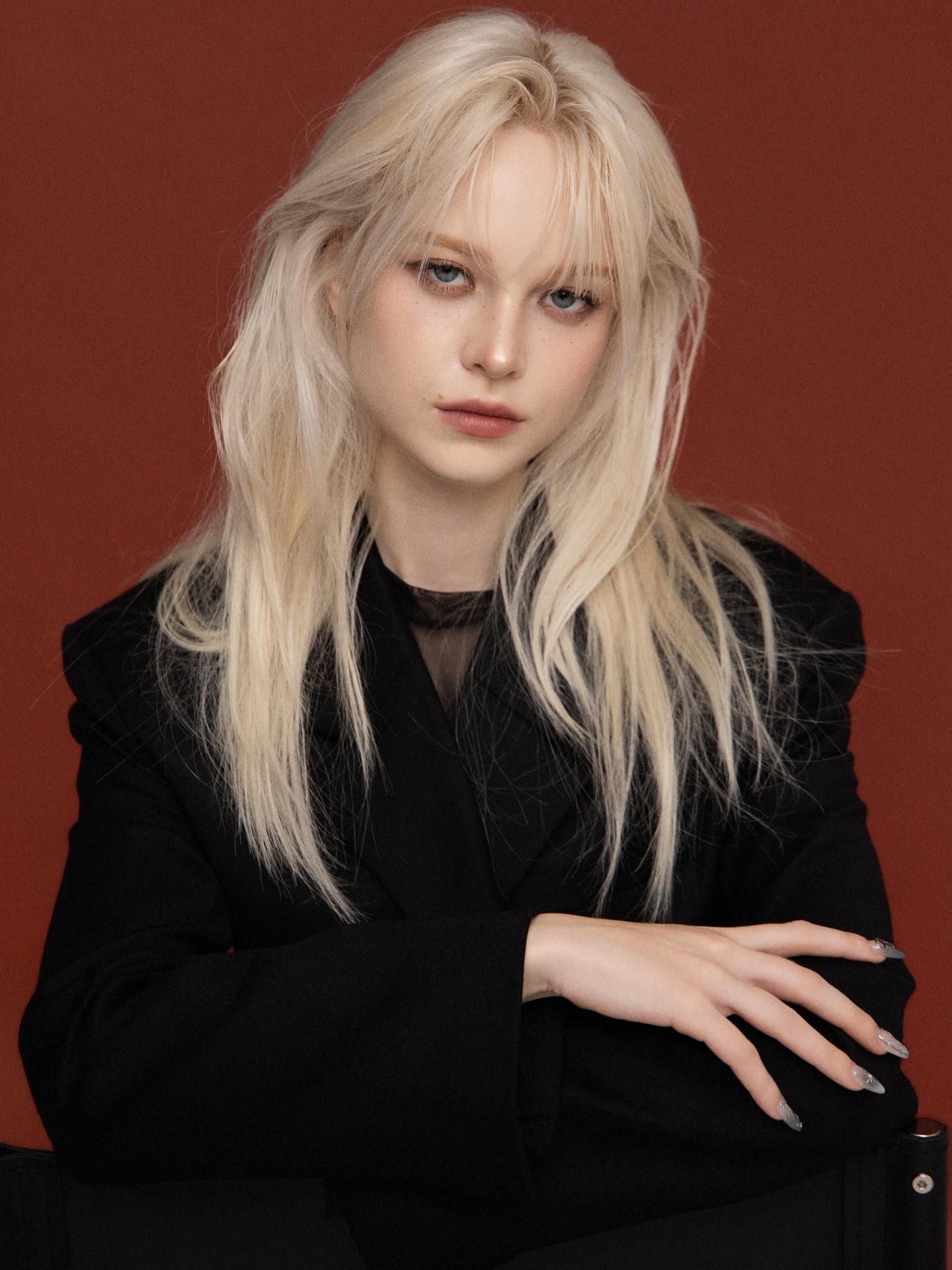 Platinum hair on rust backdrop