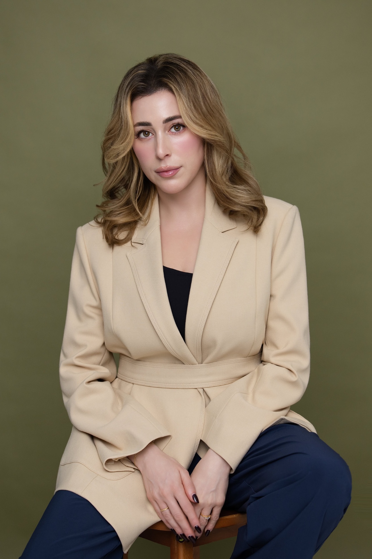 Beige blazer, olive backdrop